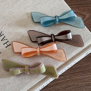 Lot de barrettes à nœuds en acétate bleu rose et vert avec détails dorés élégants