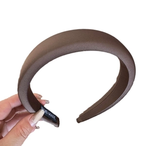 Minimalist solid dark brown sponge headband with silky texture and handmade label
