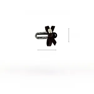 Detail showing 6.5cm velvet bow hair clip with rhinestones and 8.5g lightweight specs