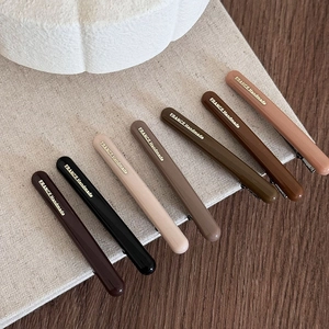 Set di 7 fermagli per capelli colorati nei toni della terra con scritte dorate France