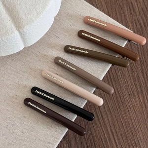 Set di 7 fermagli per capelli in resina lucida toni della terra con scritte oro su legno