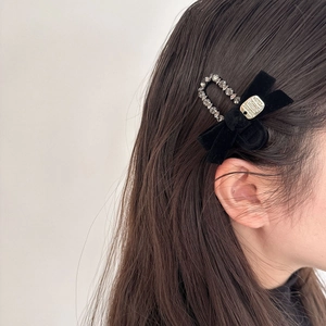 Elegant black velvet bow hair clip with rhinestone accent for French vintage hairstyles