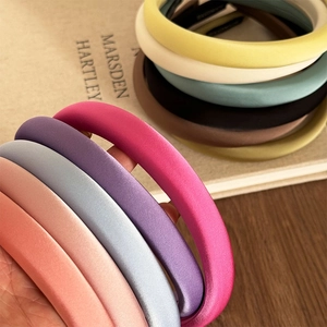 Chic padded sponge headbands in various satin colors for an elevated high-crown hairstyle look