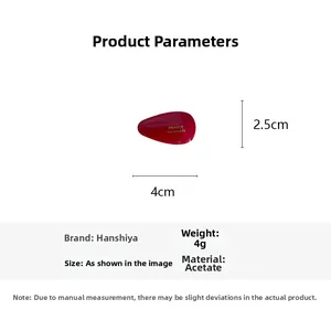 Detail of red acetate hair clip with France Handmade text and precise measurements
