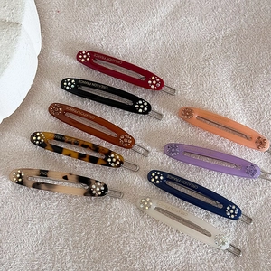 Elegante haarspeldjes set in gelei kleuren met strass steentjes en Frans ontwerp