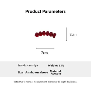 Detail view of red heart acetate hair clip showing 7cm length and 2cm width specifications