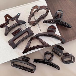 Glossy amber resin hair claw clips set in various geometric shapes for women's styling
