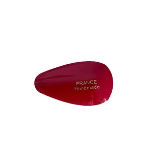Handmade red acetate teardrop hair clip with elegant gold text and polished finish