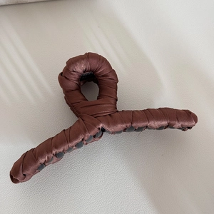 Close-up of elegant coffee brown silk fabric wrapped large shark hair claw clip