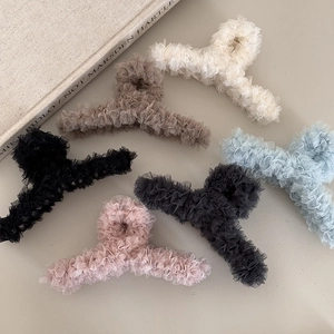 Close-up of elegant lace hair claws in six pastel colors with a soft pleated texture