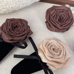 Elegant satin rose hair clips set in brown and champagne colors with velvet ribbon