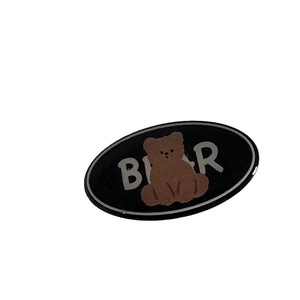 Barrette à cheveux ours ovale en colle goutte noire avec bordure argentée