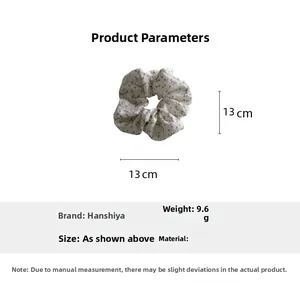 Detail showing the 13cm diameter and 9.6g weight of the white floral scrunchie hair tie