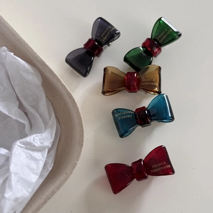 Five colored handmade acetate bow hair clips in elegant vintage style for women