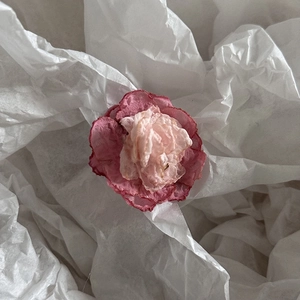 Detailed close-up of handmade pink camellia fabric flower petals for hanfu hair accessories