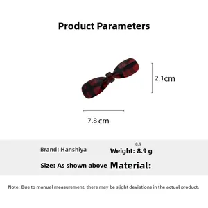 Detail view of acetate red plaid bow hair clip showing dimensions 7.8cm by 2.1cm and 8.9g weight
