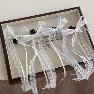 Set of four lace bow hair clips with long ribbons in mint, cream, blue and pink