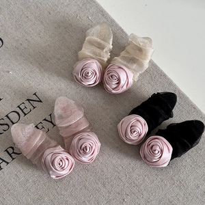 Elegant 3-pack pink satin rose hair clips with mesh trim in gold, pink, and black colors