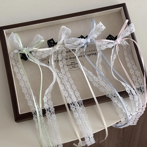 Lace bow hair clip with long ribbons in light green, ivory, blue, and pink colors