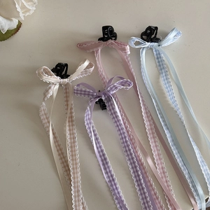 Set di quattro fermagli per capelli con fiocchi a quadri in crema, lavanda, rosa e blu