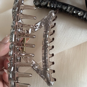Sparkling rhinestone hair claw clips in black and transparent brown for elegant styling