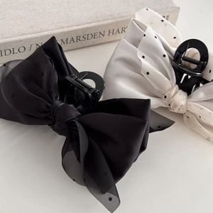 Vintage bow hair claw clips in black satin and polka dot mesh for elegant hairstyling