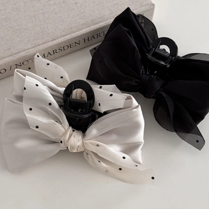 Elegant polka dot and black mesh layered bow hair claw clips for voluminous hairstyling