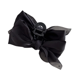 Elegant black bow hair claw clip with polka dot tulle layers for a voluminous hairstyle