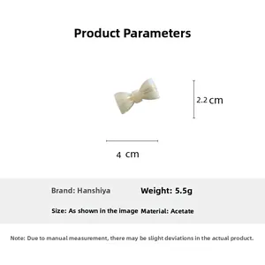 Détails sur la taille 4cm x 2,2cm et le poids 5,5g de la barrette nœud en acétate