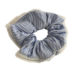 Sweet blue and white striped scrunchie with delicate lace trim for bun hairstyles
