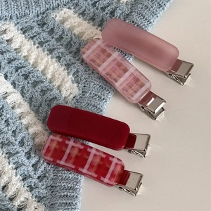 Set of four elegant plaid and solid pastel hair clips for spring styling