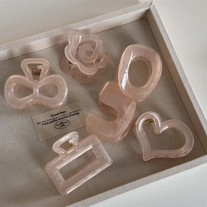 Translucent camellia hair claws with white polka dots in various shapes for women