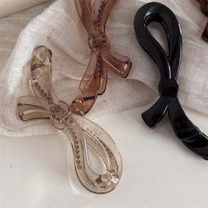 Elegante Haarklammern in Schleifenform in Bernstein, Braun und Schwarz mit Antirutsch-Zähnen
