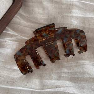 Close-up of Large Acetate Hair Claw Clip with France Handmade Gold Stamping