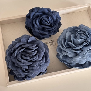 Denim blue rose hair claw clips with fabric texture for elegant French style hairstyles