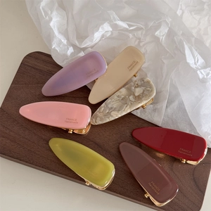 French retro acetate triangle hair clips in various colors with handmade gold lettering