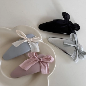 Set of four colorful fabric bow hair clips in pastel blue, pink, black and silver finish