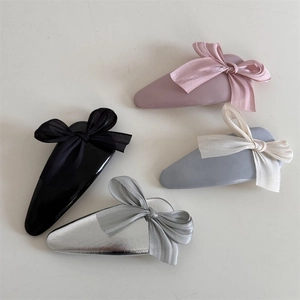 Set of four sweet fabric bow hair clips in pink, black, blue, and metallic silver