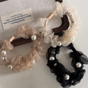 Three-piece organza scrunchie set with pearls in black, champagne, and beige tones