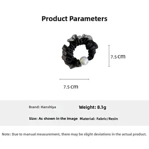 Detail view of mesh scrunchie with iridescent pearl showing 7.5cm size and 8.1g weight