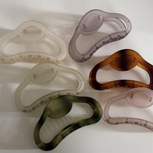 Matte finish hollow hair claws in six colors including ivory and deep green for women