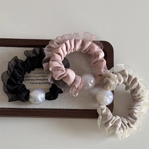 Three-piece set of mesh organza scrunchies with iridescent pearls in black, pink, and cream