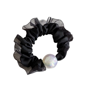 Elegant black lace hair scrunchie with iridescent pearl accent on white background