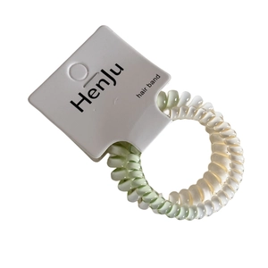 Set di due elastici a spirale sfumati verde menta e avorio su scheda di supporto