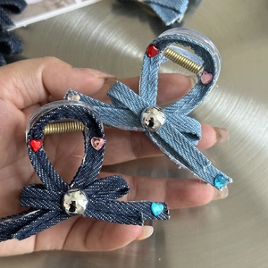 Y2K denim claw clip with heart-shaped rhinestones in light and dark blue denim fabric