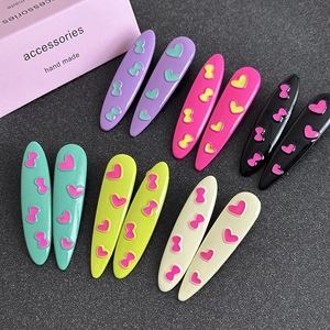 Cute oval heart and bow pattern hair clips set in colorful minimalist style