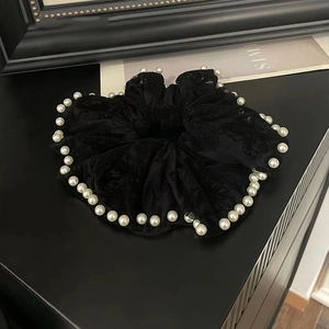 Elegant black lace scrunchie with white pearl trim and embroidered floral pattern