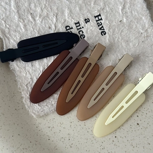 Five-piece set of matte seamless hair clips in neutral earth tones and duckbill style