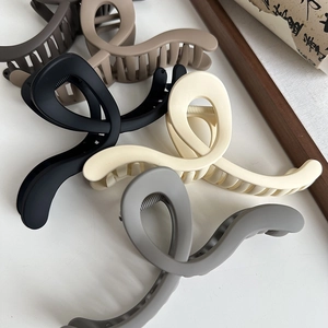 Minimalist matte large wave claw clips in multiple neutral colors for women hair styling