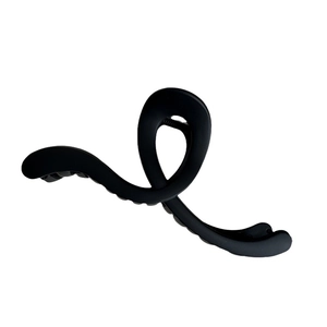 Matte black wavy claw clip for hair with minimalist crisscross spiral design